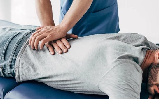 Chiropractic Nashville TN Back Adjustment Chiropractor giving a back adjustment.